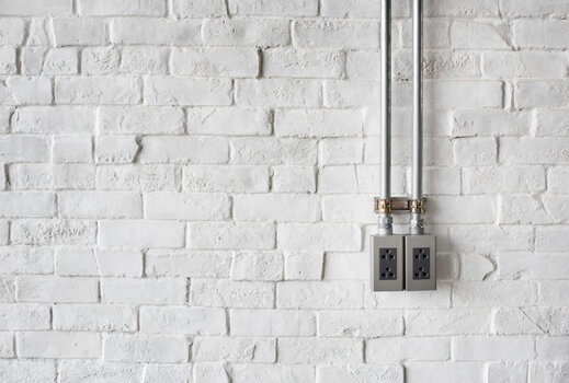 electrical-socket-white-painted-brick-wall.jpg