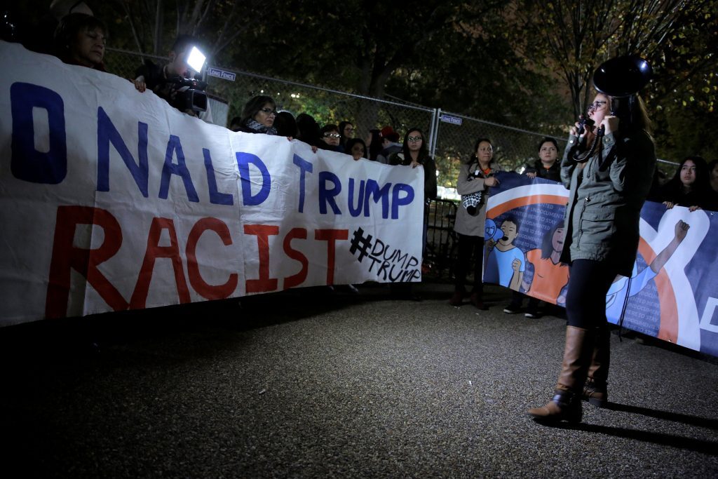Hispanic demonstrators protest in front of the White House as the polls are counted in the U.S. presidential election in Washington